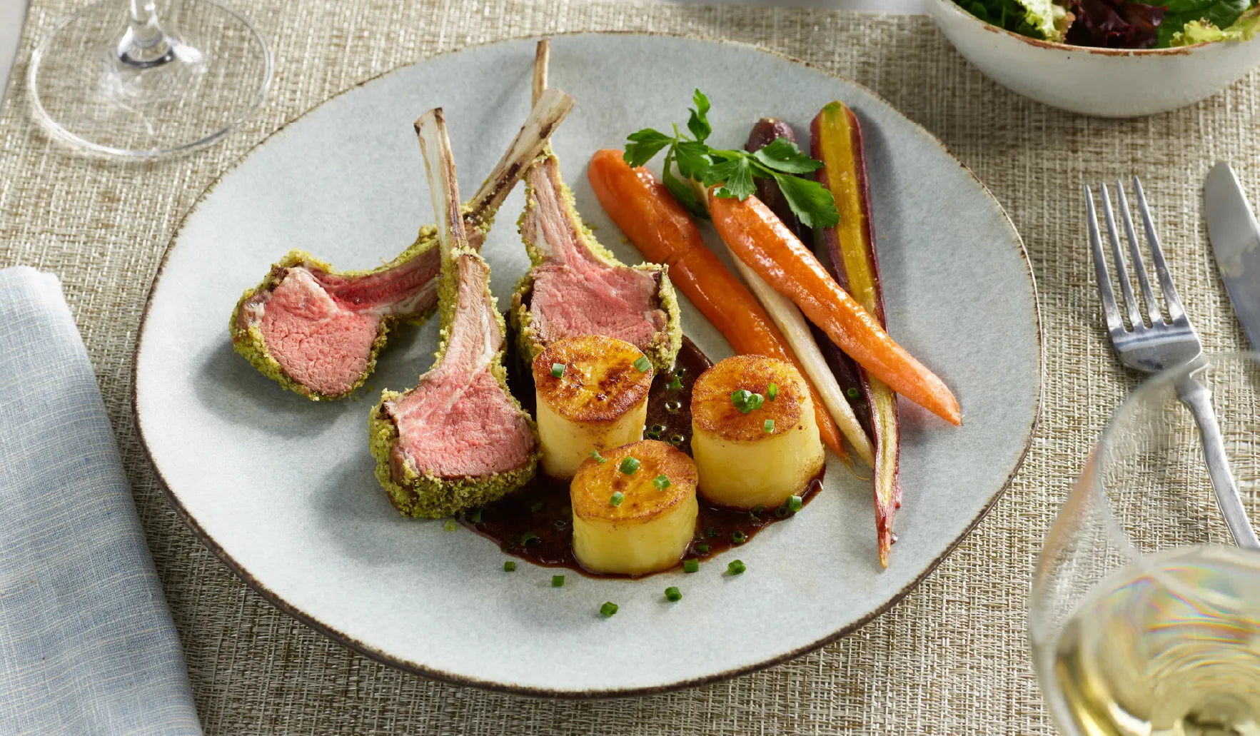 Herb Crusted Rack of Lamb with Fondant Potatoes and Roasted Glazed Carrots