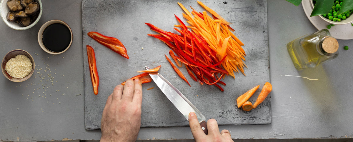 Knife chopping carrots