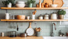 Open kitchen shelving with neatly arranged cookware and dishes, creating a functional and visually calm cooking space