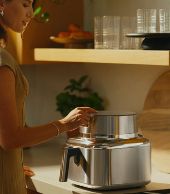 Air fryer preparing healthy home-cooked meals in a modern kitchen, supporting easy everyday healthy eating