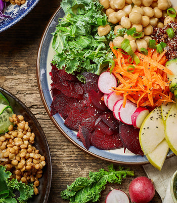 Colorful balanced meal bowl with vegetables, grains, and healthy fats representing everyday nutrition