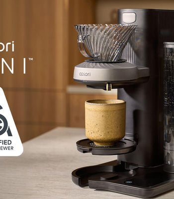 Cosori Juni coffee maker on a countertop featuring the SCA Certified Home Brewer seal