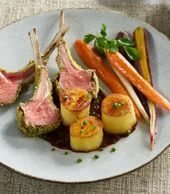 Herb Crusted Rack of Lamb with Fondant Potatoes and Roasted Glazed Carrots