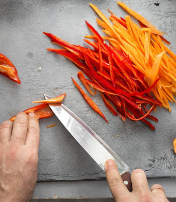 Knife chopping carrots