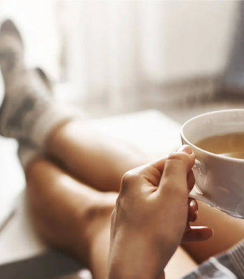 Enjoying a freshly brewed cup of coffee as part of a relaxing morning routine at home