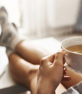 Enjoying a freshly brewed cup of coffee as part of a relaxing morning routine at home