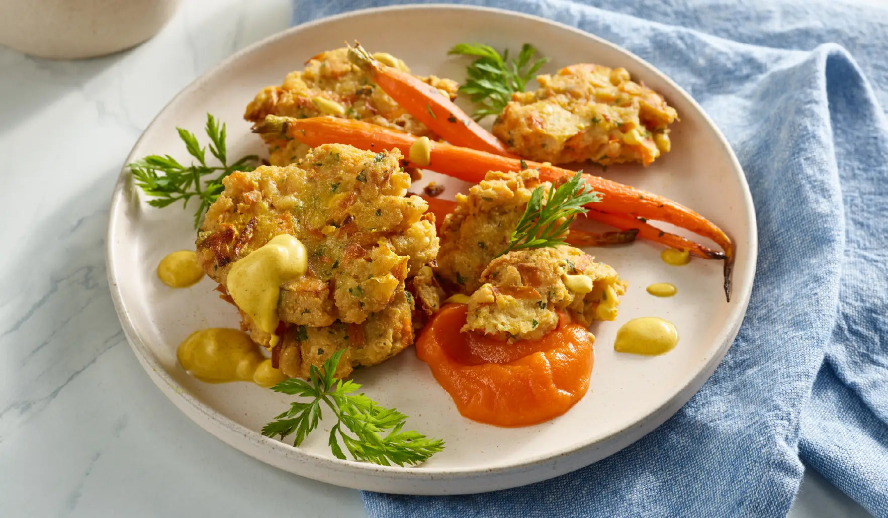 Roasted Carrots & Carrot-Top Frittelles With Ginger-Lime Carrot Purée & Curried Crema