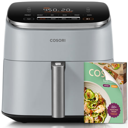 COSORI TurboBlaze 6-quart air fryer in light gray with recipe booklet
