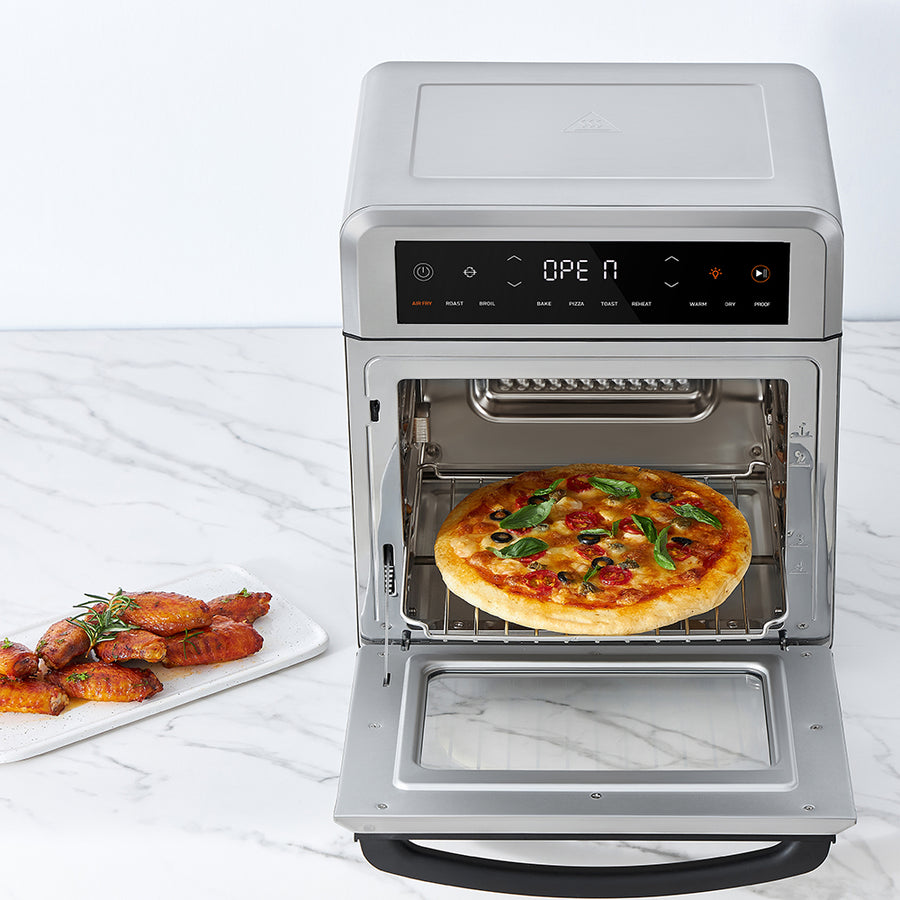 COSORI 13-Quart Air Fryer Oven with wire rack cooking pizza inside