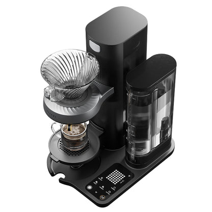 Close-up of Juni coffee maker control panel and base with brew settings buttons