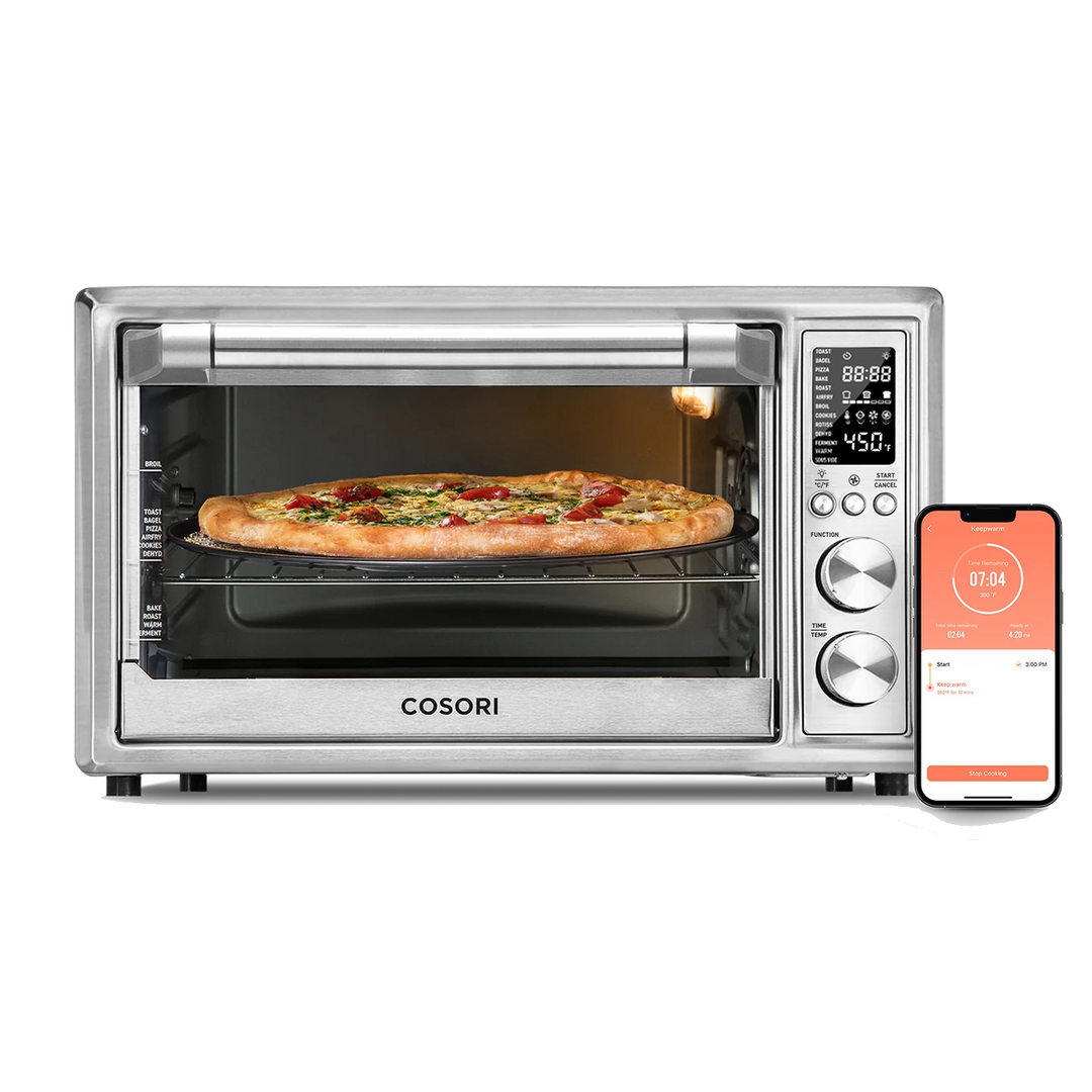 COSORI 30 Liter Smart Air Fryer Toaster Oven with pizza inside and smartphone app displayed beside the unit