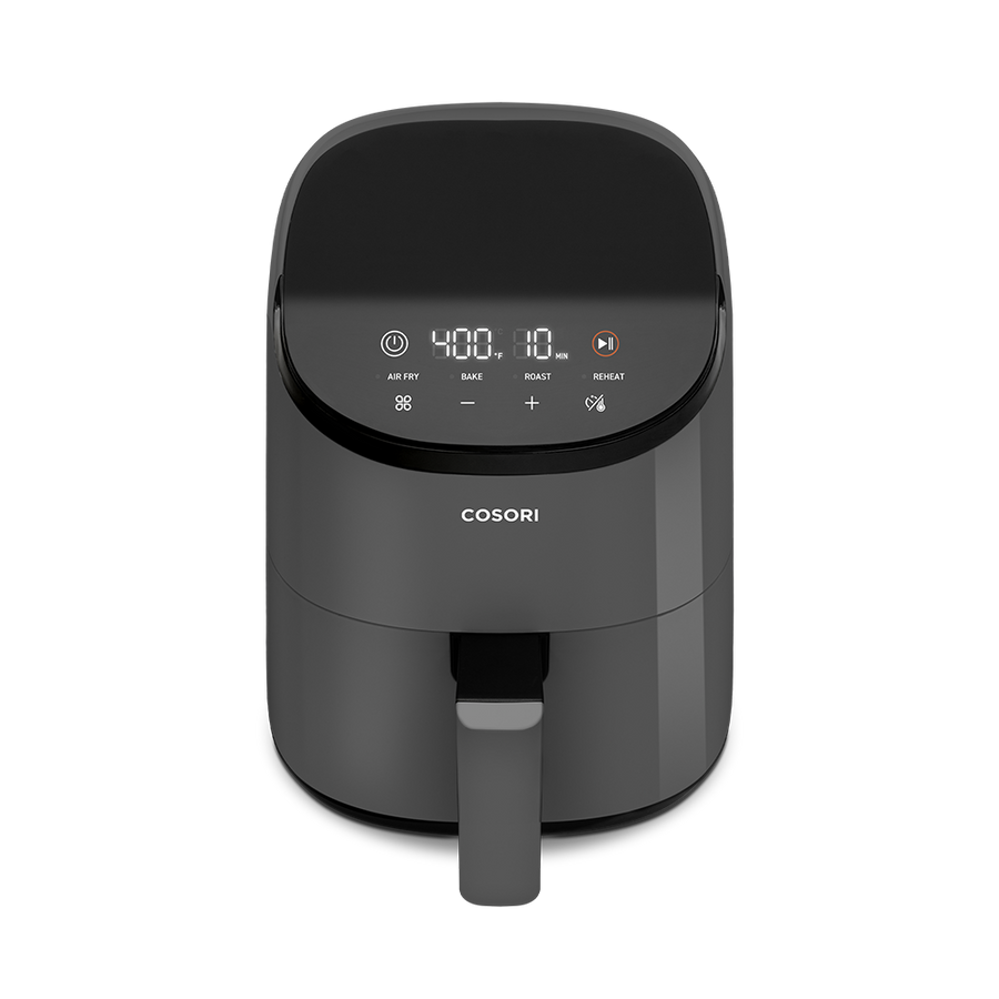 High-angle view of the dark grey Cosori Mini Air Fryer showing its small countertop footprint