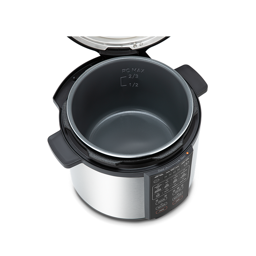 Top-down view into the open 6-quart pressure cooker pot, showing the nonstick interior coating