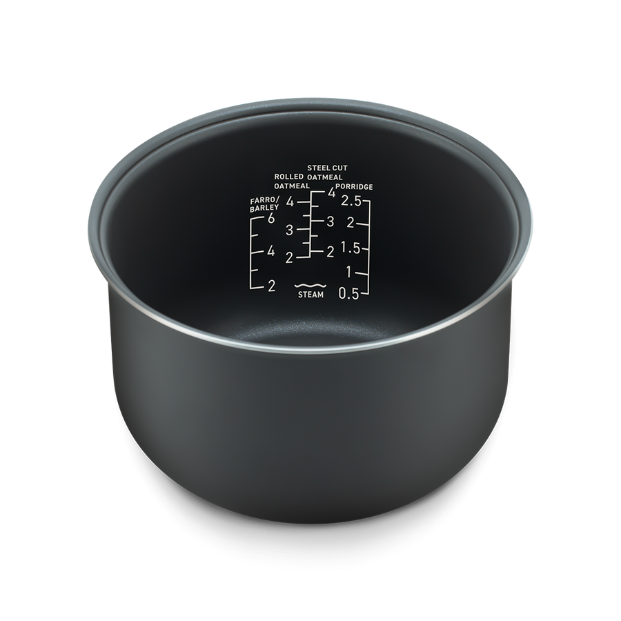Angled view of the inner pot showing clear water measurement markings for different grain types.