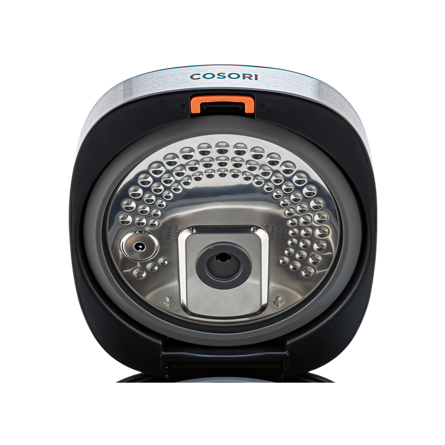 Close-up view of the detachable inner lid inside the Cosori Rice Cooker.