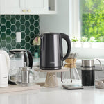 COSORI Double-Wall Stainless Steel Electric Kettle placed on kitchen countertop in home setting