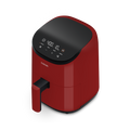 Angled front view of the red Cosori Lite 2.1-Quart Mini Air Fryer showing its matte finish