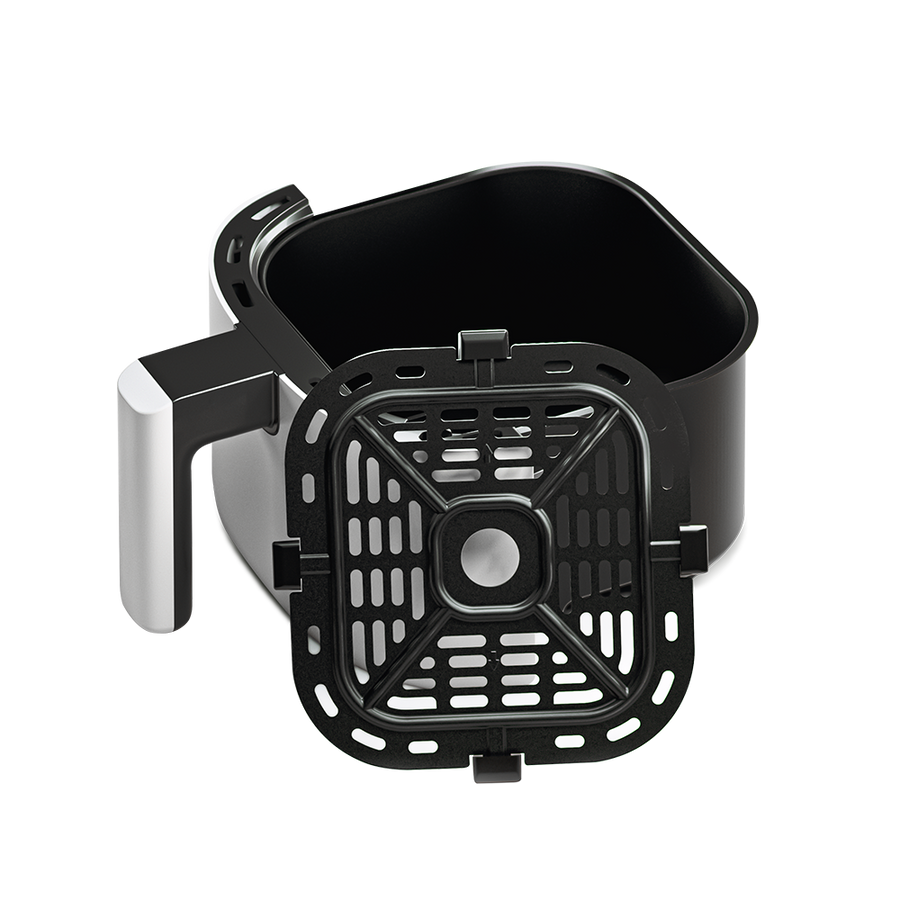 White Cosori Mini Air Fryer basket pulled out to reveal the dishwasher-safe nonstick interior.