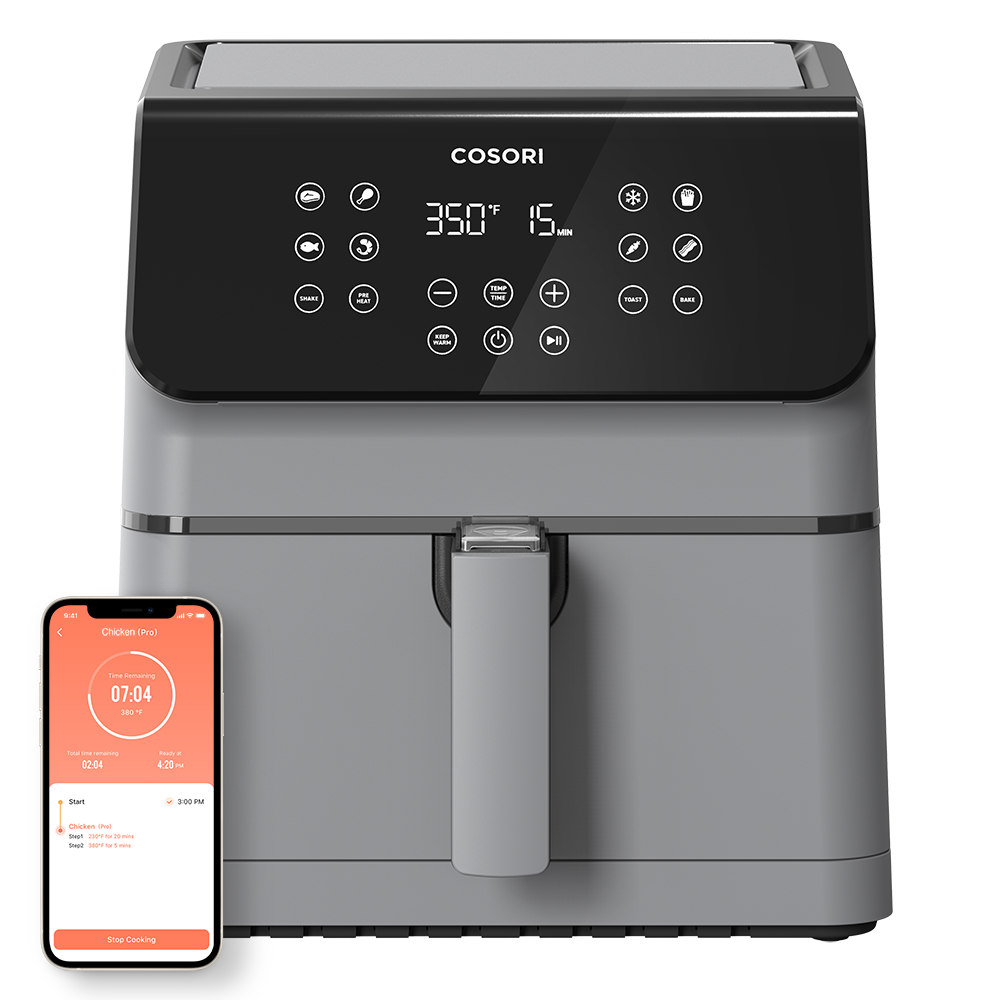 Cosori Pro II 5.8-Qt Smart Air Fryer in grey shown with a smartphone displaying the VeSync app control.