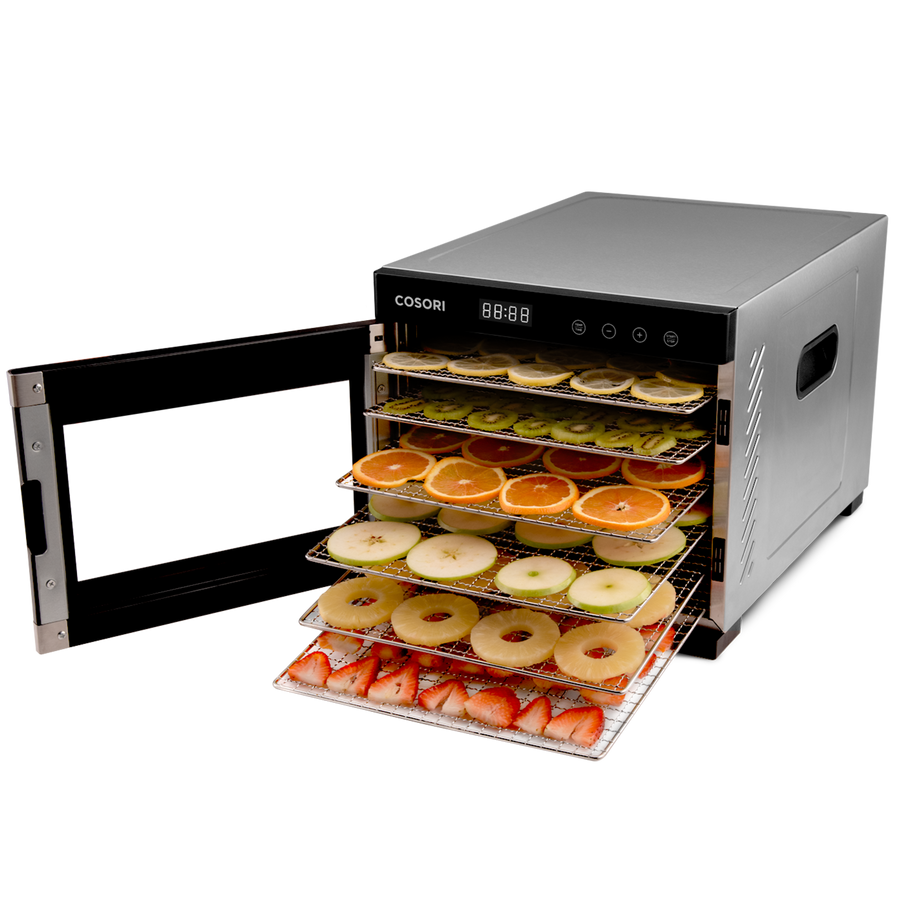 COSORI food dehydrator with door open showing trays filled with sliced fruit